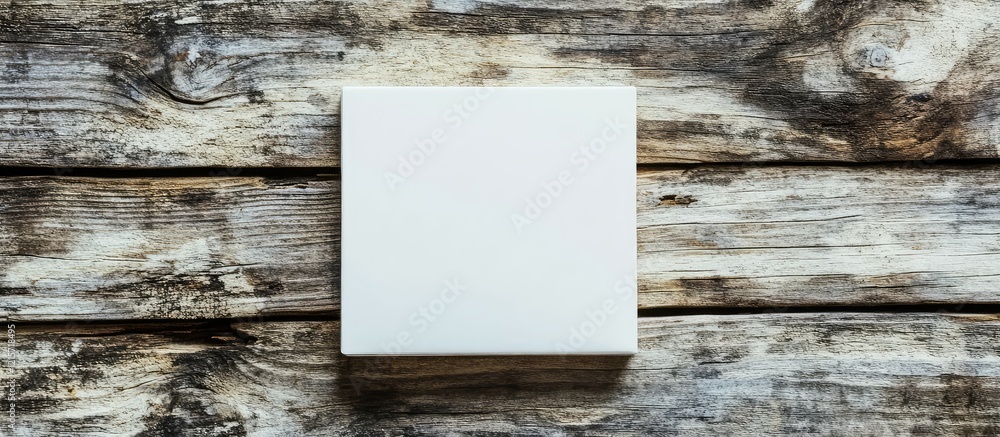 Poster white square calendar placed on rustic wooden background with ample empty space for text, natural co