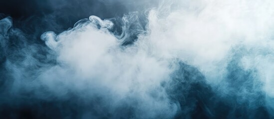 Fototapeta premium Elegant white smoke swirling on a dark blue background creating a serene atmosphere with ample space for text and design elements