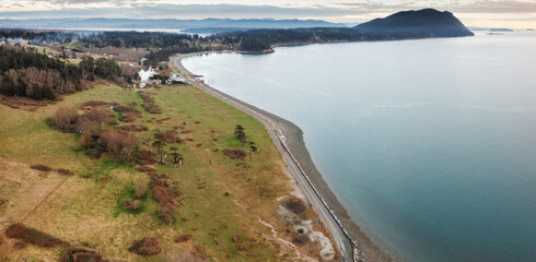 Aerial drone view of the west side of Lummi Island, Washington. The coastline of this island...