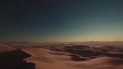 Fototapeta premium Starry night over a vast, snow-covered desert landscape with mountains in the distance.