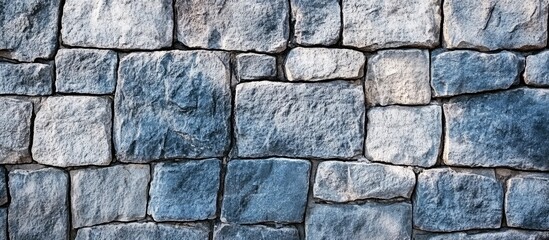 Fototapeta premium Weathered Blue Stone Wall Grunge Background for Text Overlay with Halftone Texture and Copy Space Ideal for Design and Advertising