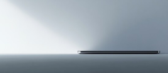 Minimalist Workspace with Laptop on Seamless White Background Ideal for Promotional Use and Text Placement in Creative Design