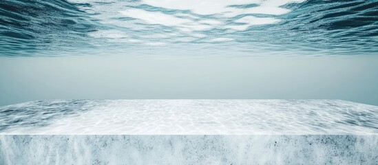 Tranquil ocean surface with reflections creating a serene glass-like canvas ideal for text placement or artistic overlays.