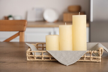 Candles on tray on table in room. Closeup