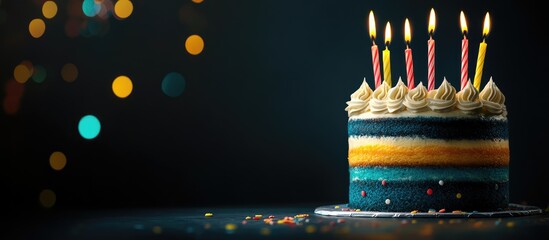 Colorful 60th Birthday Cake with Candles and Bokeh Background Featuring Blank Space for Customizable Text Celebrating Milestone Years
