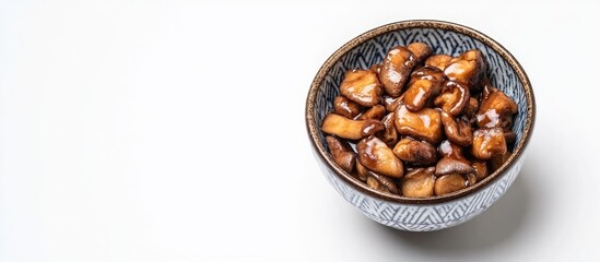 Fototapeta premium Bowl of Japanese sitakotage mushrooms on white background with ample copyspace for culinary or promotional text