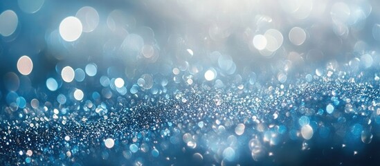 Light blue shimmering bokeh background creating a dreamy atmosphere with ample copyspace for text or branding elements.