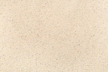 Texture of light beach sand as background