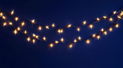 Holiday illumination and decoration concept - Christmas garland bokeh lights over dark blue background 