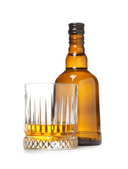 Bottle and glass of rum on white background