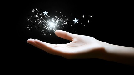 Hand holding glowing light and stars.