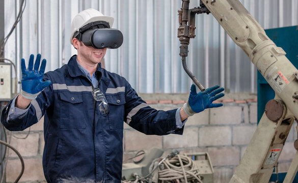 Worker uses virtual reality technology for training in a modern industrial setting - Powered by Adobe