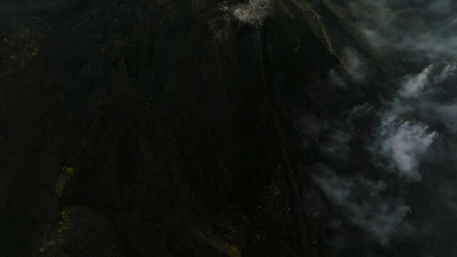 Paricutin Volcano crater surrounded by mist and rugged terrain in Michoacan, Mexico