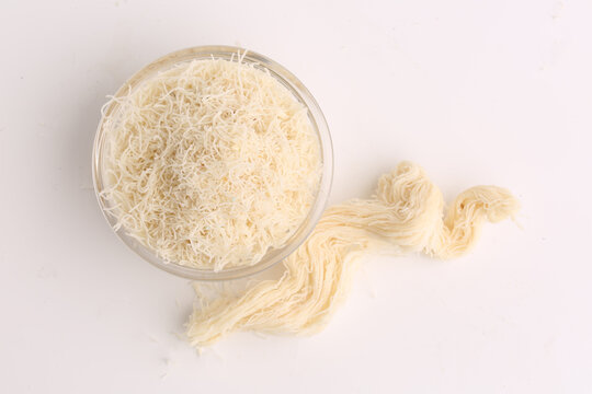bowl with kadaifi dough on grey background