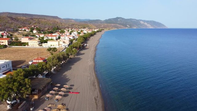 Longest and secluded Greek island Vatera beach beautiful landscape surrounding the sea and mountains, Lesvos Island, Revealing drone view