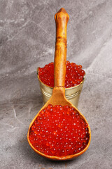 wooden spoon with red caviar