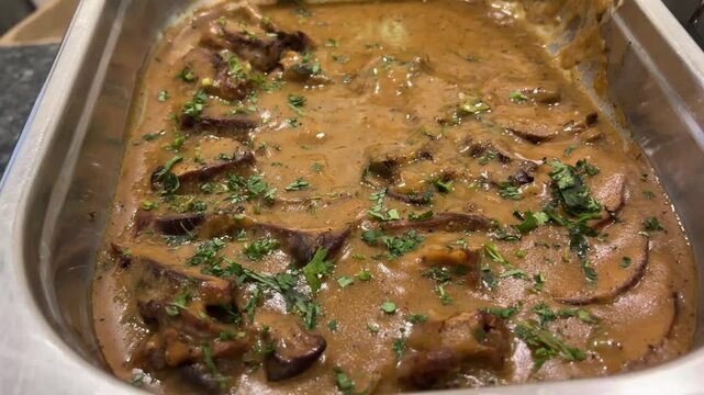 Mutton roast prepared with rum in Bengali style in Kolkata