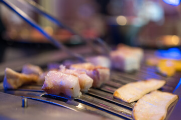 Barbecue of fresh pork belly in Korean traditional style. Close up