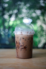 Plastic cup of iced cocoa, cafe menu concept.