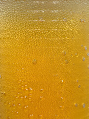 Cold beer alcohol water drops close up background. Stock photo.