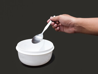 hand holding spoon