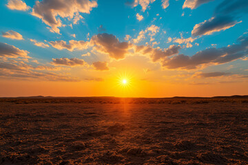 Obraz premium vast desert landscape under vibrant sunset sky, showcasing warm orange and blue hues with dramatic cloud formations, evokes sense of tranquility and awe