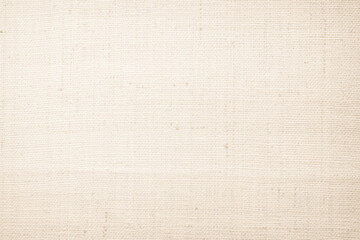 Closeup detail of beige fabric texture background. High resolution photo.