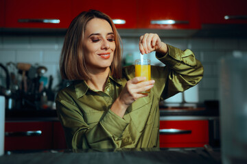 Woman Mixing in an Aromatic Collagen Drink for Skin Routine. Happy lady using multivitamin powder medical supplement 
