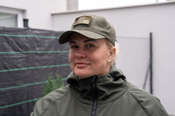 Girl servicewoman of the Ukrainian army. Woman soldier. Portrait. Girl in military uniform olive.