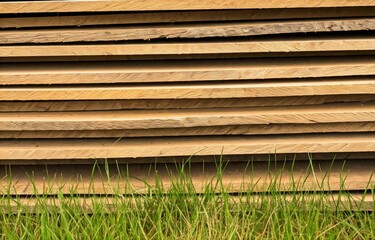 wooden board pile in grass texture background