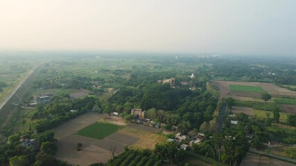 Aerial drone shot of Hazarduari Palace in Murshidabad, showcasing its grand architecture and lush grounds.