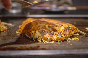 Okonomiyaki is one of Osaka’s famous foods.Teppanyaki is a Japanese cuisine that uses an iron griddle to cook food.