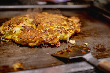 Okonomiyaki is one of Osaka’s famous foods.Teppanyaki is a Japanese cuisine that uses an iron griddle to cook food.