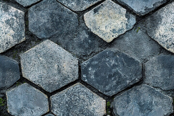 Obraz premium A close-up view of delicate street tiles on the ground. (Generative AI)