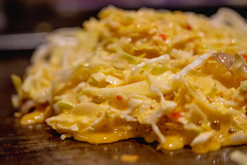 Okonomiyaki is one of Osaka’s famous foods.Teppanyaki is a Japanese cuisine that uses an iron griddle to cook food.