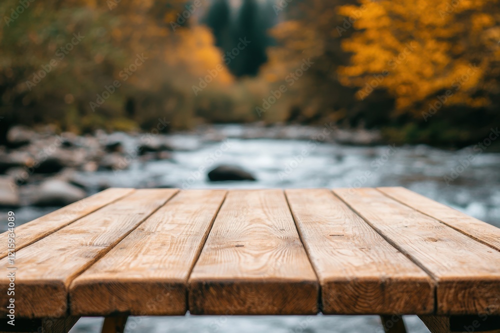 Poster empty wooden table overlooking flowing river in autumn forest