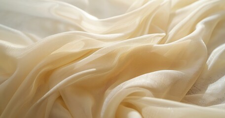 Soft, flowing fabric in a delicate cream hue, creating an elegant and serene atmosphere.