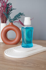 mouthwash liquid in a container on table 