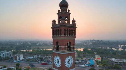 Aerial drone shot of Lucknow’s Clock Tower, with the sun rising behind it, creating a silhouette.