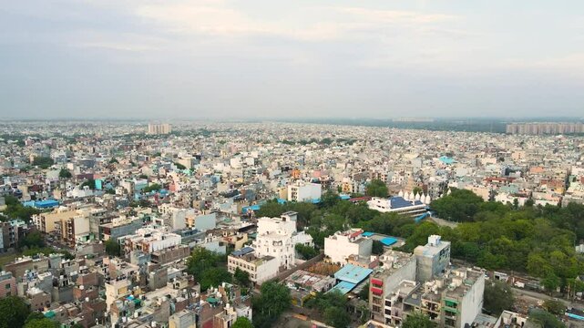 Stunning aerial view of Dwarka, Delhi, with its high-rise buildings and wide roads under the bright sky.