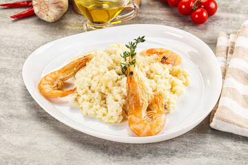 Italian risotto with prawn served thyme