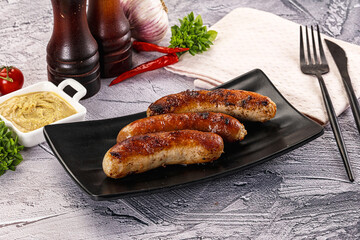 Delicous natural roasted sausages in the plate