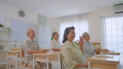 Asian female instructor teaching mature students in language school.