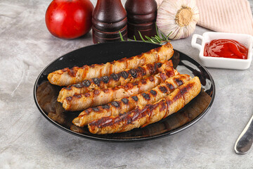Grilled meat sausages wrapped bacon