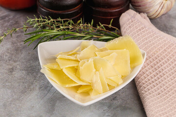 Parmesan cheese slices in the bowl