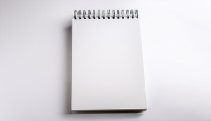 Blank spiral notebook on white background.  Perfect for note-taking or sketching.