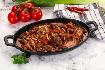 Baked chicken hearts with vegetables