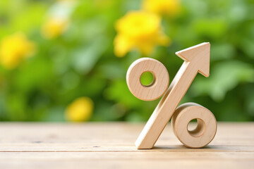 a wooden percentage symbol located on a wooden surface. There is a blurred background in the background.