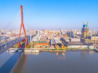 Naklejka premium aerial view of YangPu Bridge, which lies across the Huangpu River in Shanghai, China