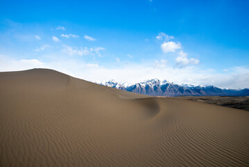 Russia. Beautiful scenery of the northernmost desert in the world. View of the Kodar Ridge. Chara sands. The region of baikaL Kodar National natural park.